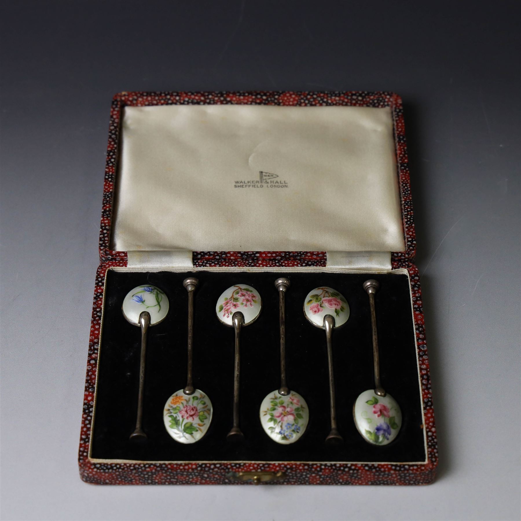 Set of six enamel coffee spoons, each decorated with guilloche enamel flowers to the underside of the bowls,  hallmarked Walker & Hall, Birmingham 1951, in fitted case