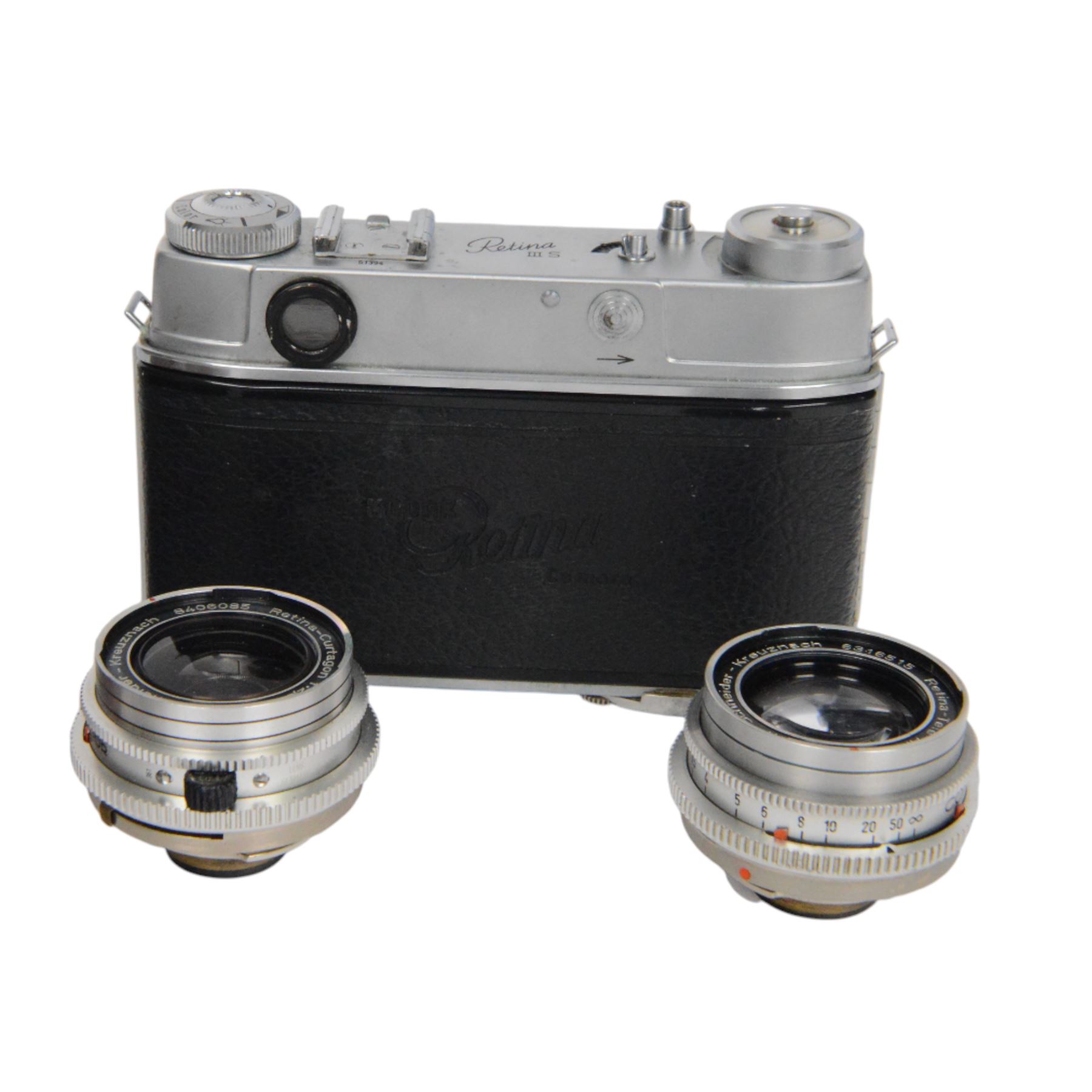 Kodak Retina III S camera outfit, comprising camera body serial no. 51394, three Schneider-Kreuznach lenses including Retina-Xenon f:1.9/50mm, Retina-Curtagon f:2.8/35mm and Retina-Tele-Arton f:4/85mm, viewfinder, close up rangefinder, filters and hood, contained within a brown Kodak carry case