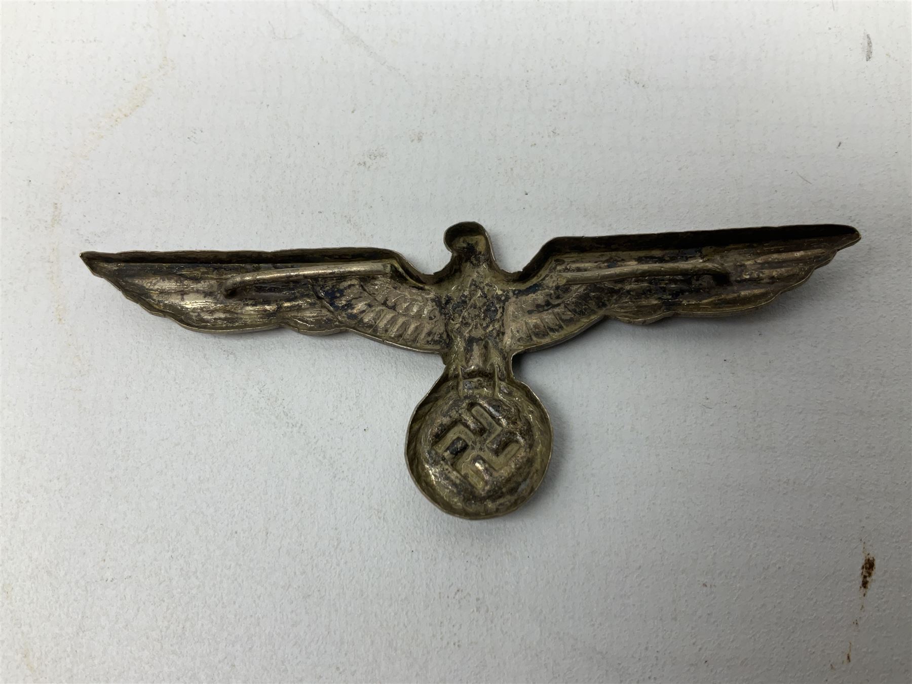 Five WW2 German peaked cap badges, four with double-pinned backs