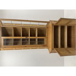 ‘Lizardman’ oak corner cabinet, two lead glazed doors enclosing four shelves, two panelled doors enclosing double cupboard below, by Derek Slater of Crayke