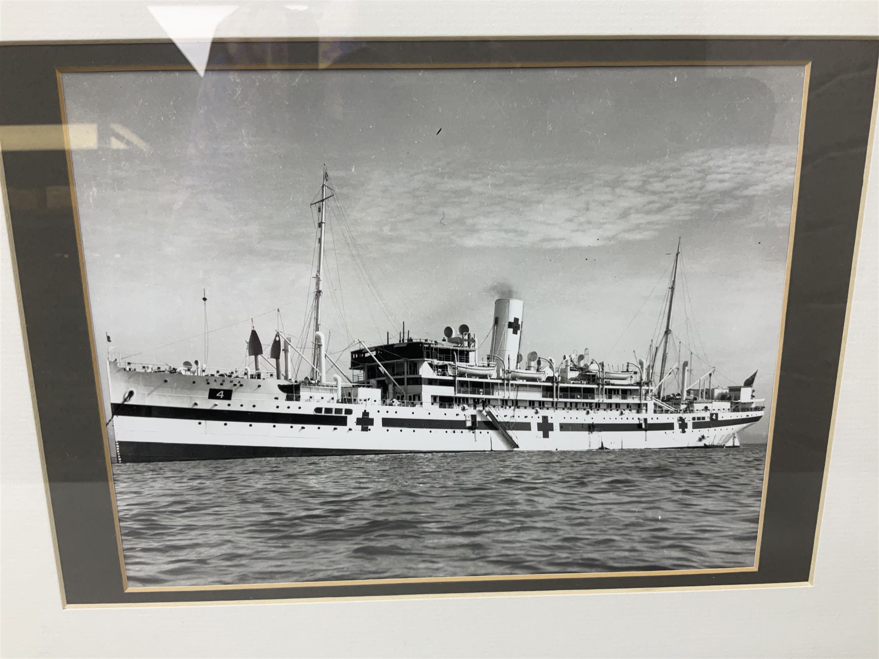 Set of twelve monochrome photographs of mid-20th century merchant vessels comprising general cargo ships, cargo liners, RMMV passenger cargo liners and hospital ship including Rowallan Castle, Drakensberg Castle, Stirling Castle, Capetown Castle, Pachumba, Tilapa etc; average size 18 x 24cm; uniformly mounted in black frames (12)