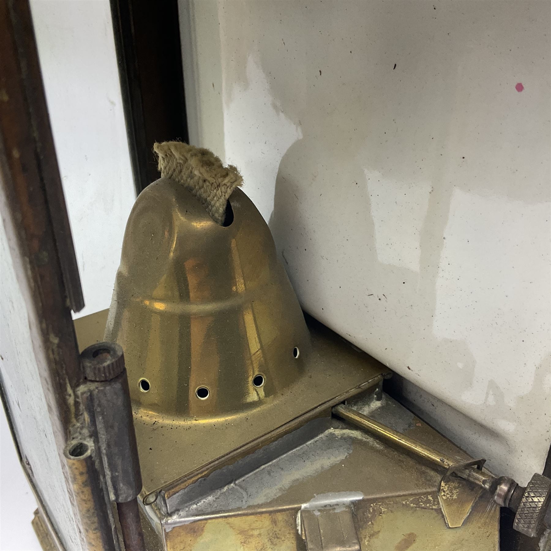 Large brass maritime lamp by Griffiths & Sons Birmingham with swing handle, threaded mounting bracket and associated oil burner, H41cm excluding handle