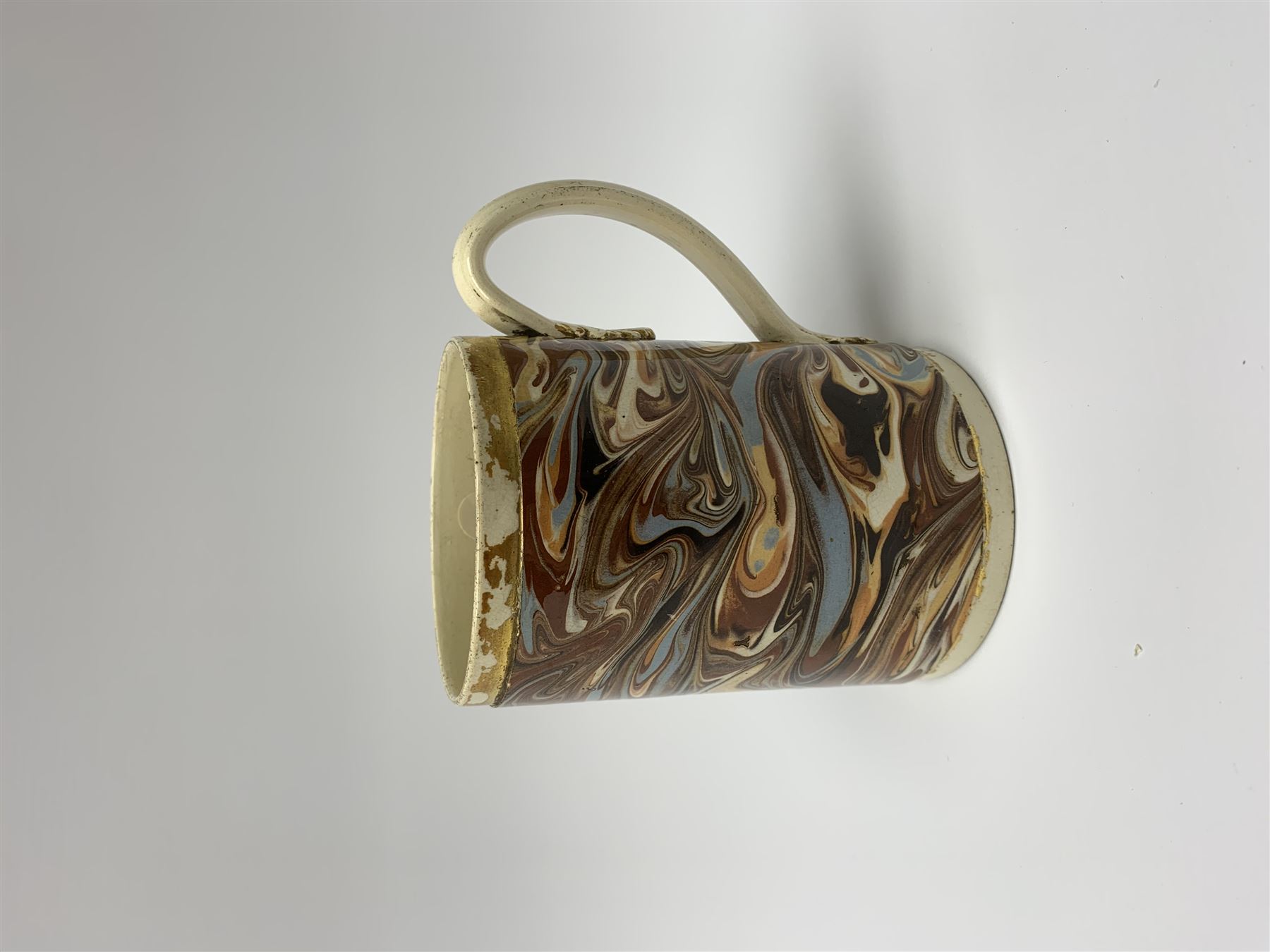 Late 18th century earthenware mug, possibly Ralph Wedgwood, Burslem or Ferrybridge, with surface marbled decoration and later gilt detail to rims and handle, impressed beneath Wedgwood & Co, H12cm