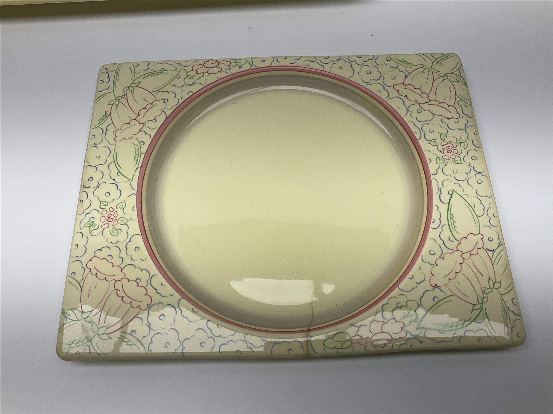 Clarice Cliff Biarritz part dinner set, circa 1930, for Royal Staffordshire, of rectangular form, decorated with bluebells, to include one serving plate, six dinner plates, three side plates, etc, printed mark beneath with reg no 784849 (17)