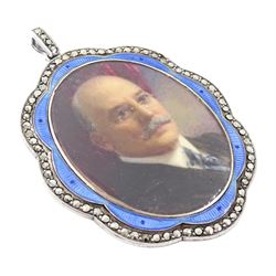 Early 20th century silver guilloche enamel portrait pendant, set with an oval miniature of a gentleman wearing a grey suit on ivory, within a blue enamel and marcasite border, the reverse set with a blue enamel panel and single split pearl, within a silver engraved border, suspended from a marcasite bail

This lot has been registered for sale under Section 10 of the APHA Ivory Act