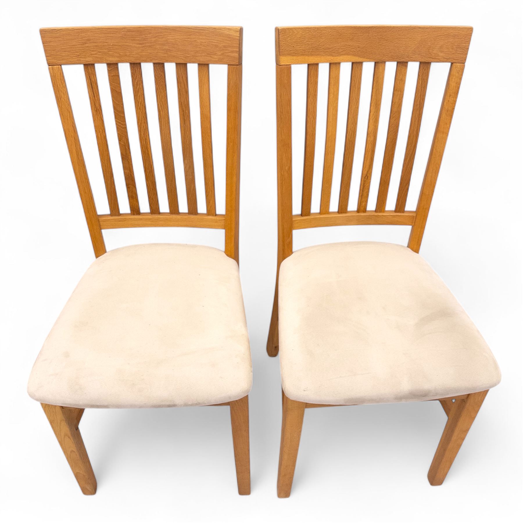 Contemporary solid oak rectangular dining table, with two additional extension leaves, together with eight matching high back dining chairs upholstered in cream suede-effect fabric (9) (Chair H 95cm, W 41cm, D 53cm) (Extends to 270cm)