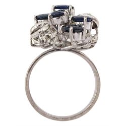 Oval cut sapphire and diamond cluster ring
