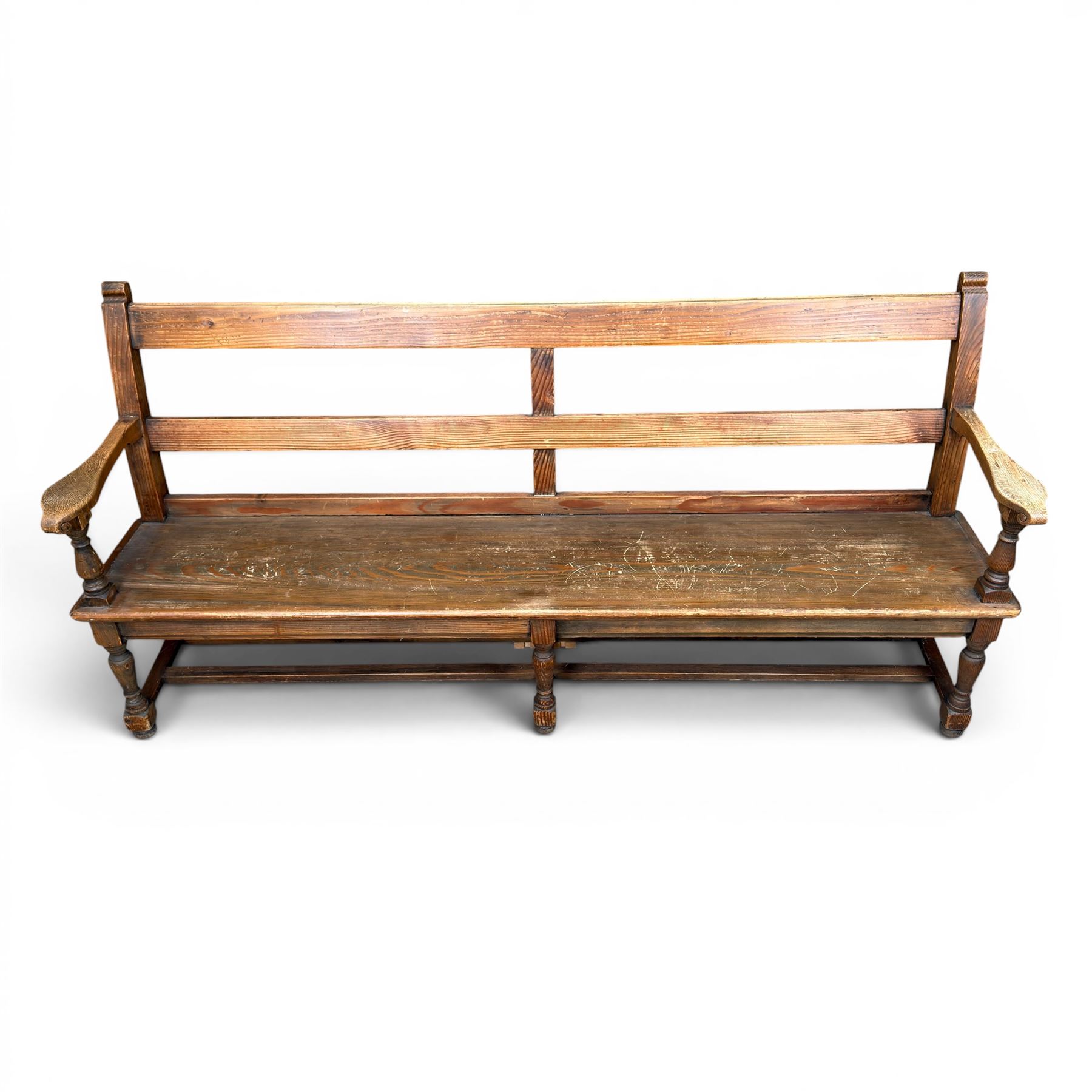 Early 20th century pine and oak bench seat, stained pine rail back frame with shaped oak arms