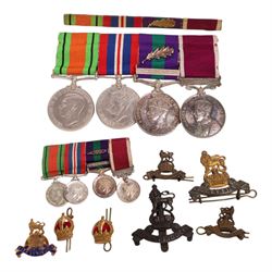 WWII medal set, comprising Defence medal, War medal, General Service medal with Malaya clasp and oak leaf, and Long Service And Good Conduct medal, awarded to Major J Troops. R.A.P.C, together with the matching miniatures, medal bar, Royal Army Pay Corps cap badges and ephemera relating to J Troops       