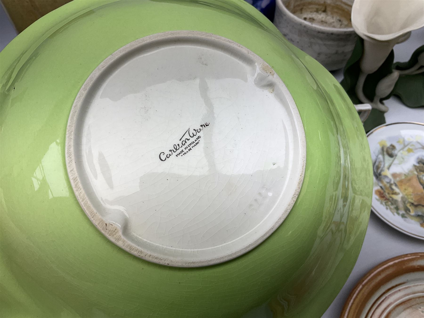 Carlton Ware bowl in the form of an apple, together with a pair of ceramic wall baskets, West Germany vase, and other collectables, in two boxes 