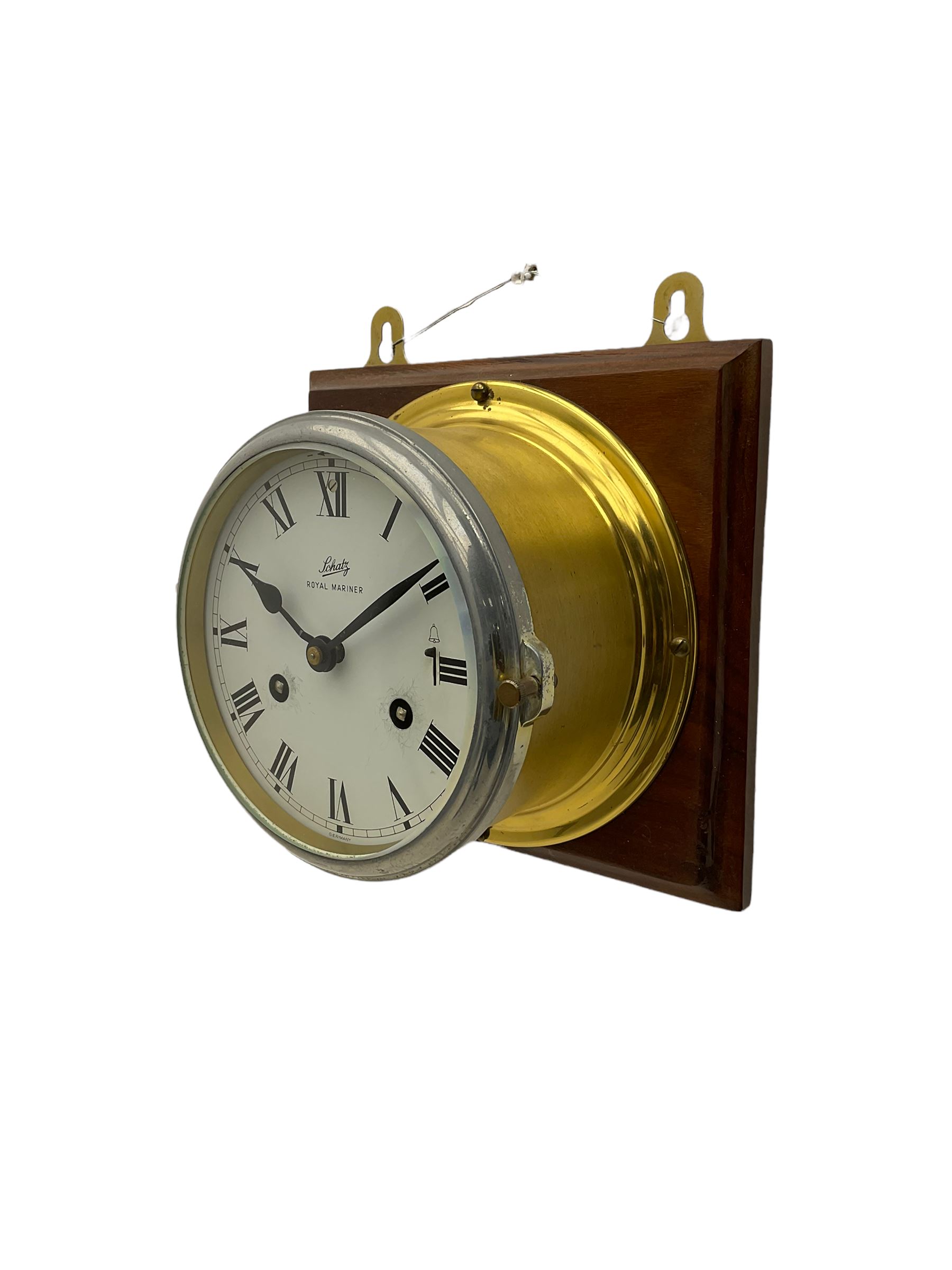A compact German manufactured ships clock in a spun brass case with a 5