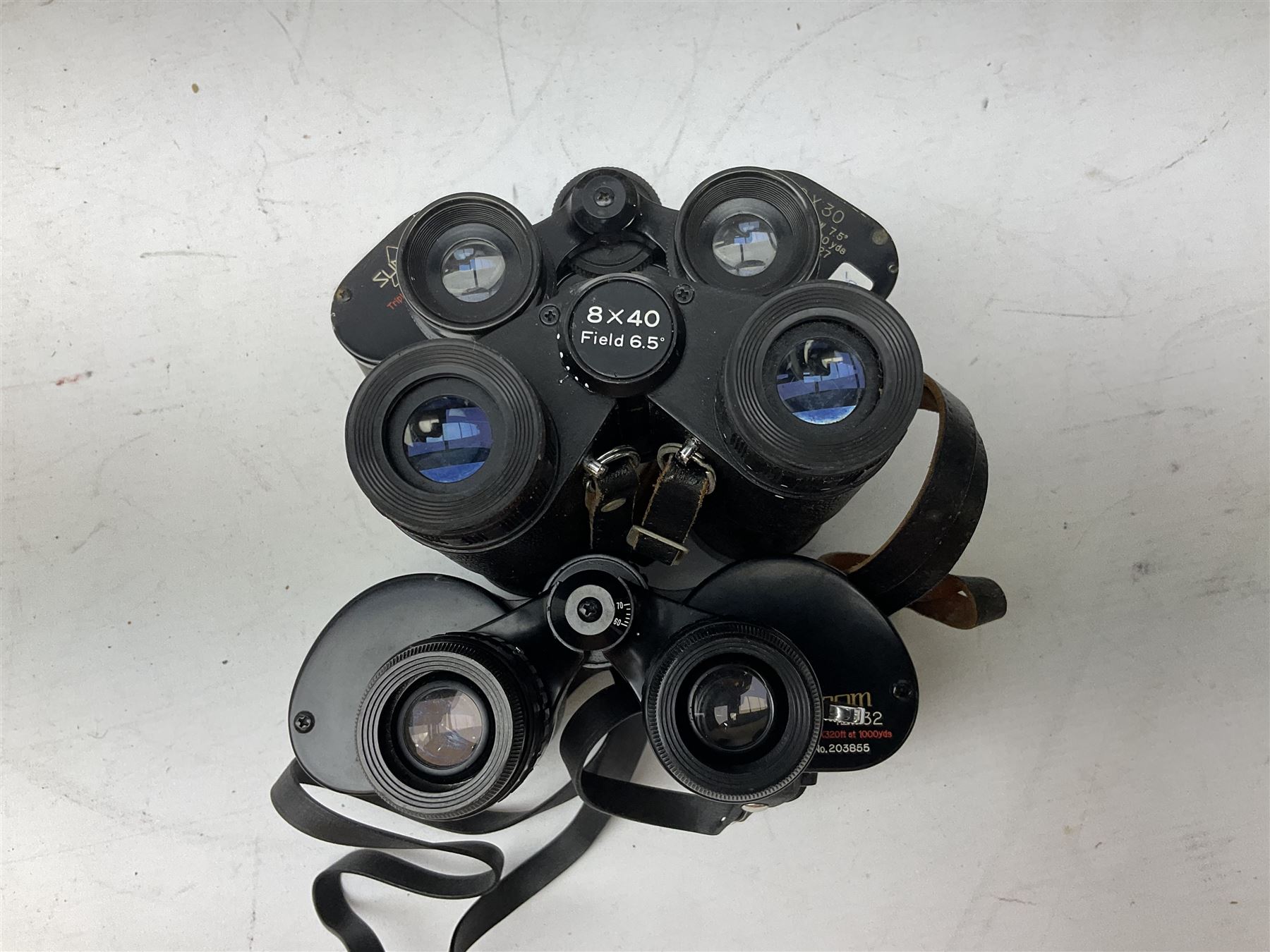Eleven cased pairs of binoculars to include Summit 8x30,  Concord 8x40, Tasco no. 106 8x - 16x40, Chinon 10x50, Tokina 7x42 Field, Zoom 6x- 12x32 etc