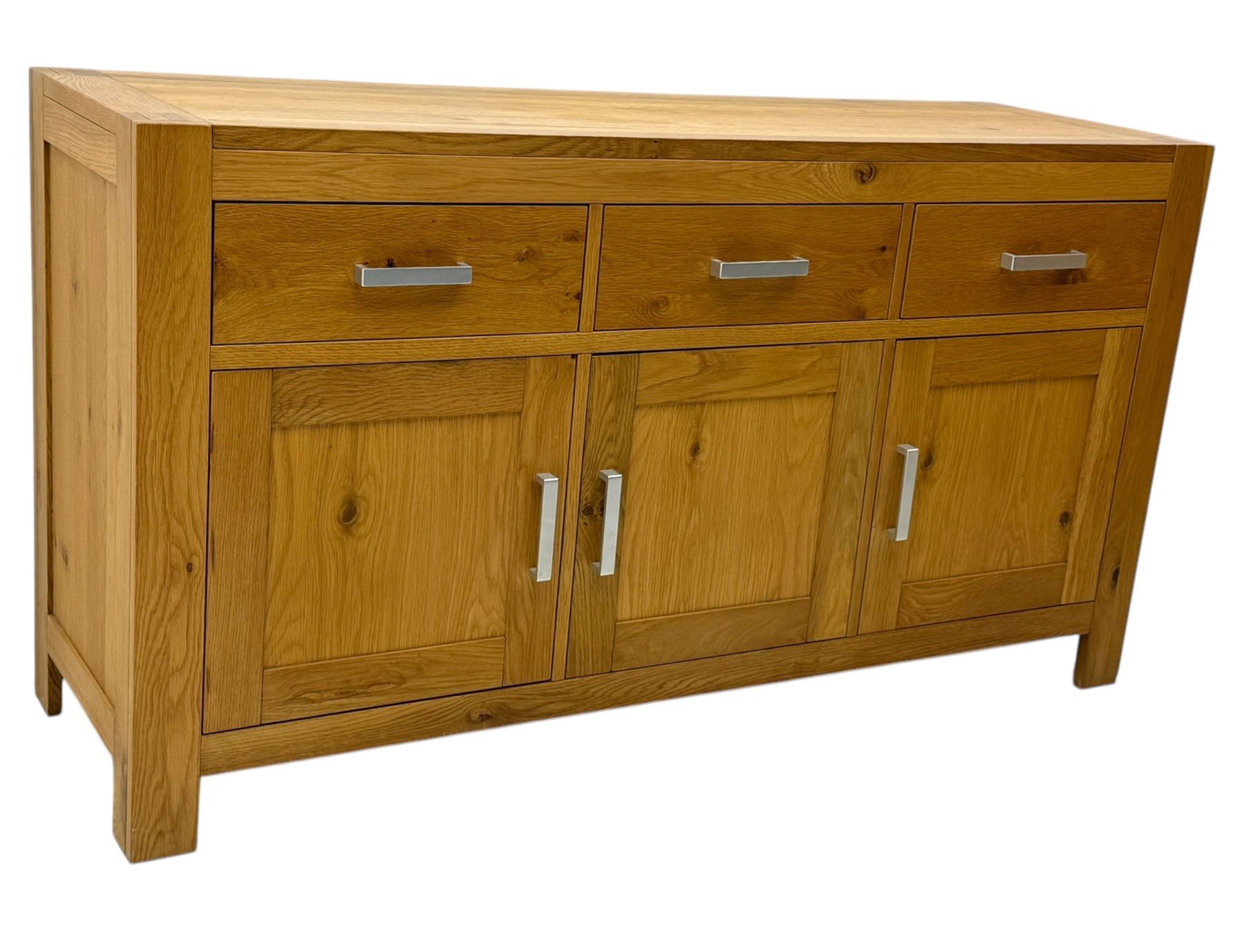 Light oak sideboard, fitted with three drawers and three cupboards, metal handles