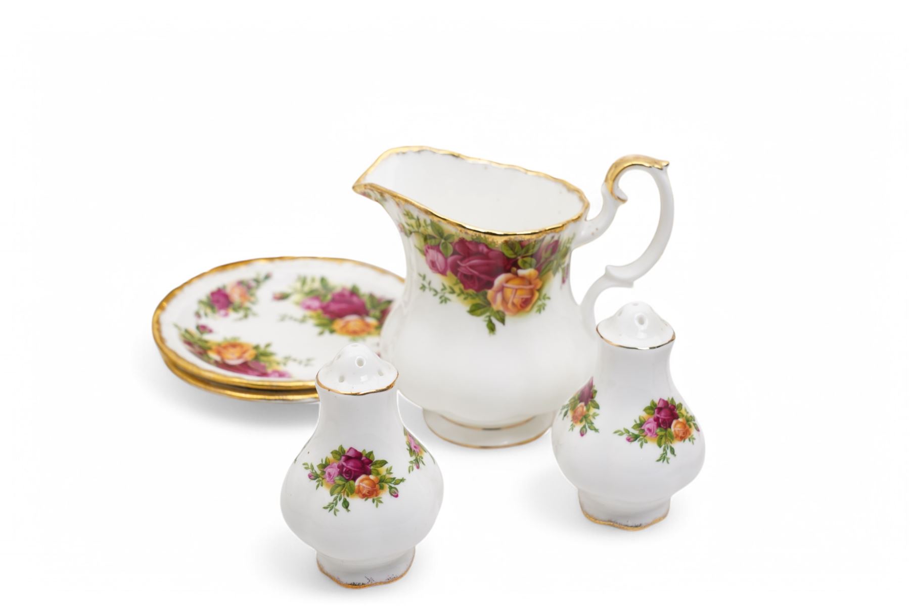  Royal Albert Old Country Roses tea and dinner service comprising nine dinner plates, nine dessert plates, nine cups, eight saucers, milk jug, salt and pepper, bread knife and two saucer dishes