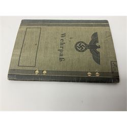 WW2 German Coastal Artillery Wehrpass for Marinehelfer Harald Ammann with small archive of modern research information.