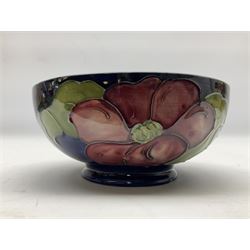 Moorcroft Clematis pattern footed bowl on a blue ground, with with impressed and painted mark beneath, D15.5cm