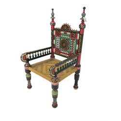 Pakistani armchair, turned frame with all-over painted decoration, rush string seat