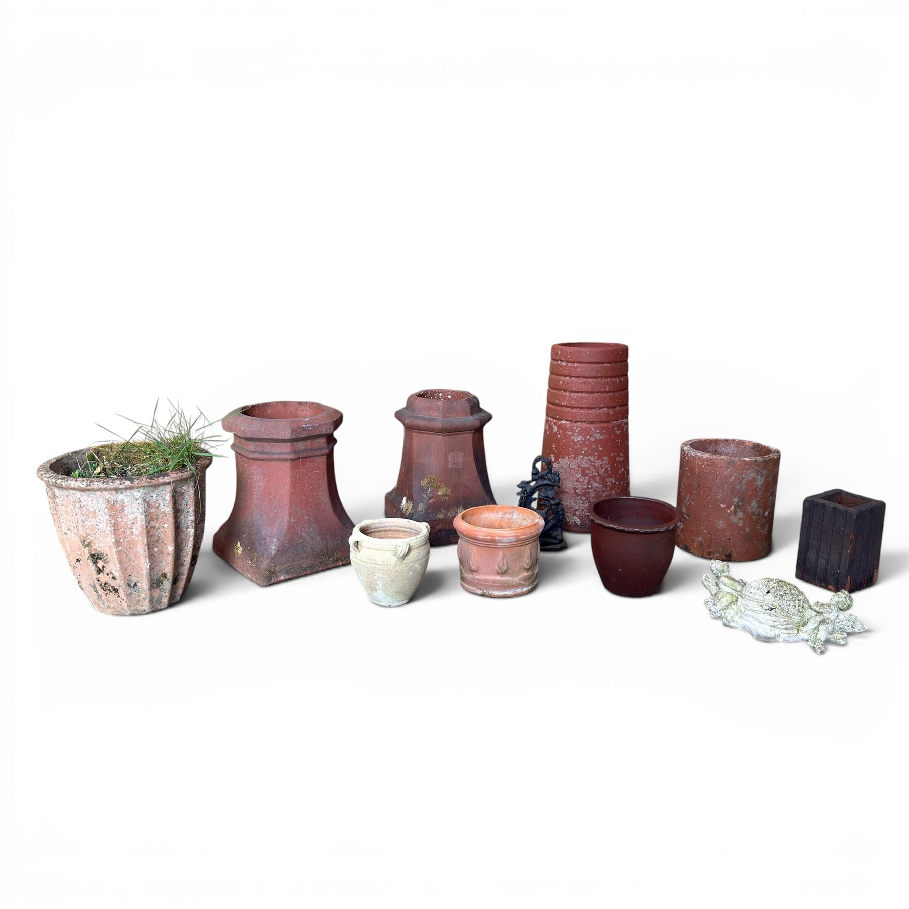 Two Victorian terracotta octagonal squat chimney pots, three other pots, terracotta planter, three small planters, cast iron fox door stop and a cherub wall pocket