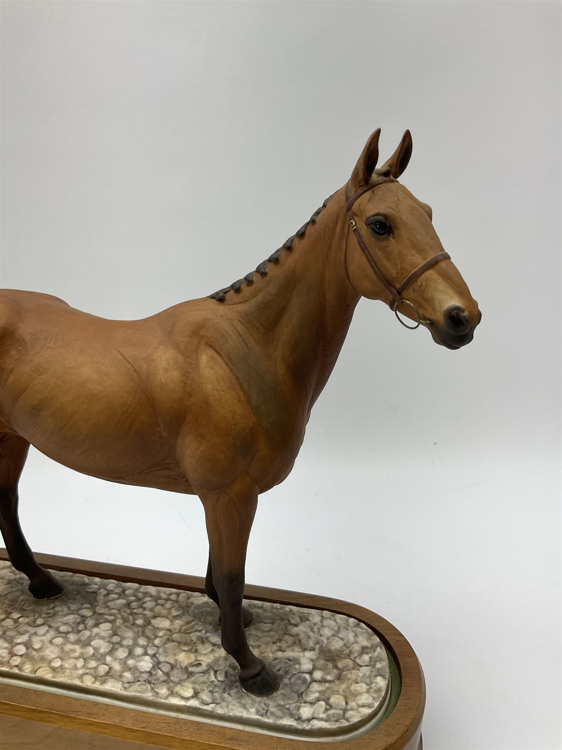 A Royal Worcester limited edition figure, Arkle, owned by the Duchess of Westminster, modelled by Doris Lindner, on wooden base, H27cm. 