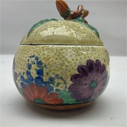 Clarice Cliff for Newport Pottery ceramics, comprising preserve jar and Bon Jour shape teacup, both in Crocus pattern, together with a Clarice Cliff for Wilkinson Ltd, preserve jar with cover, in Gayday pattern, preserve jar H10cm