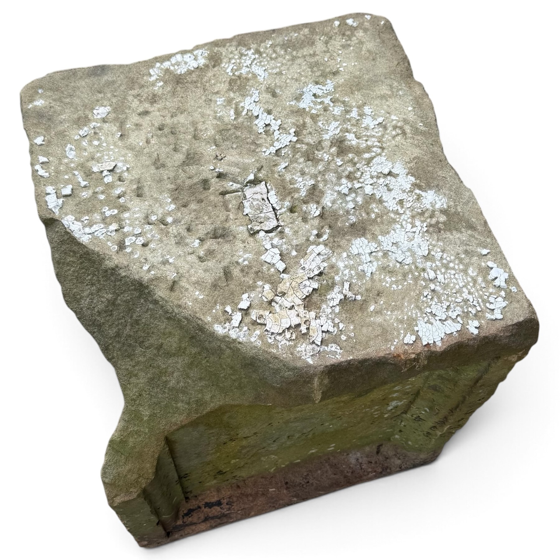 Two 18th century carved sandstone architectural elements, comprising a substantial square pedestal block with recessed panelled facias (W42cm H45cm); and a frieze fragment carved in relief with three stylised flowerheads and an undulating foliate stem (W30cm H18cm)