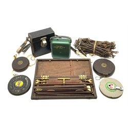 19th century mahogany and brass pantograph inscribed John Miller Edinburgh in mahogany case L33cm; Cowley Automatic level serial no.57125 in leather carrying case with paperwork dated 1963; surveyor's chain; and four surveyor's measuring tapes (7)