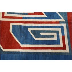 20th century Anatolian Turkish indigo ground rug with Art Deco inspired abstract design in tones of ivory, crimson and coral