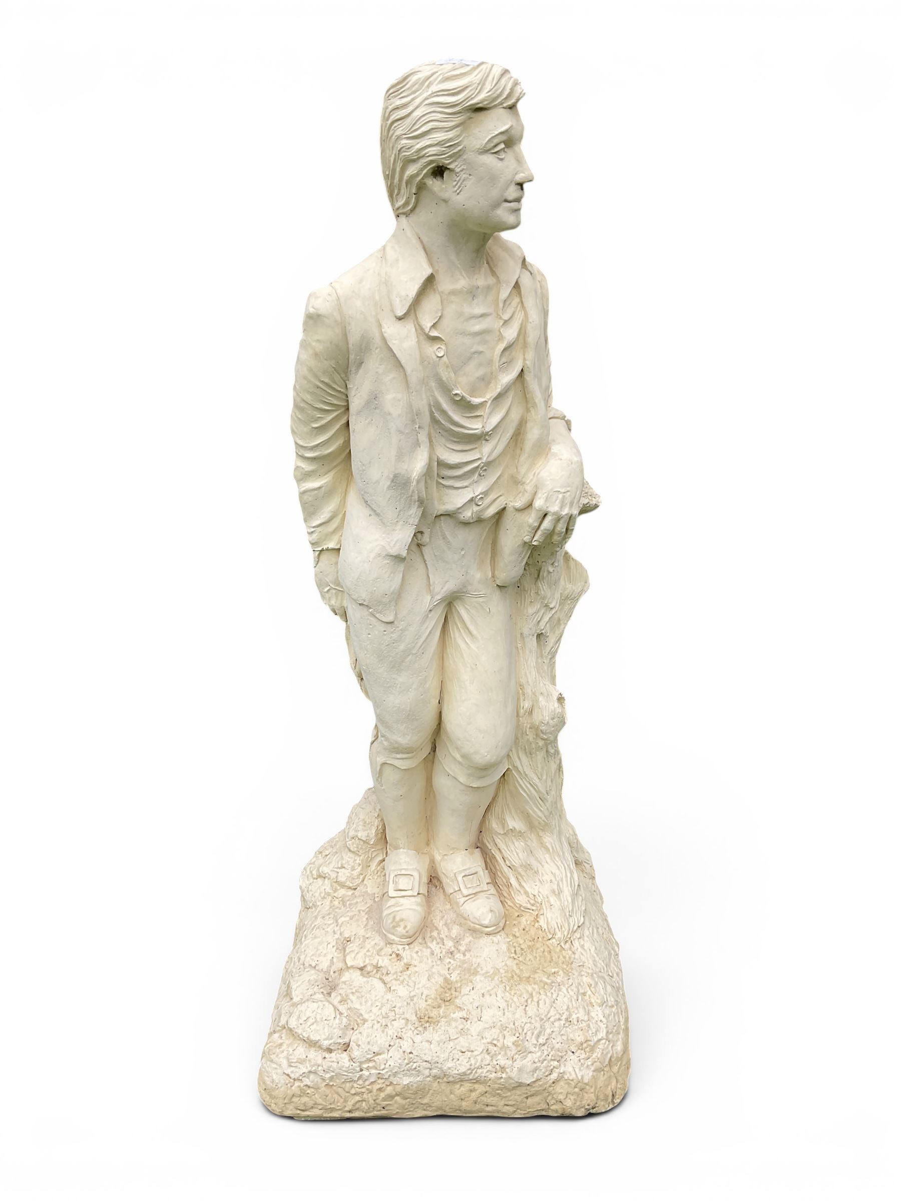 Cast stone garden statue of a Regency style gentleman, modelled with a side parting and unbuttoned shirt with breeches, on a naturalistic rectangular base