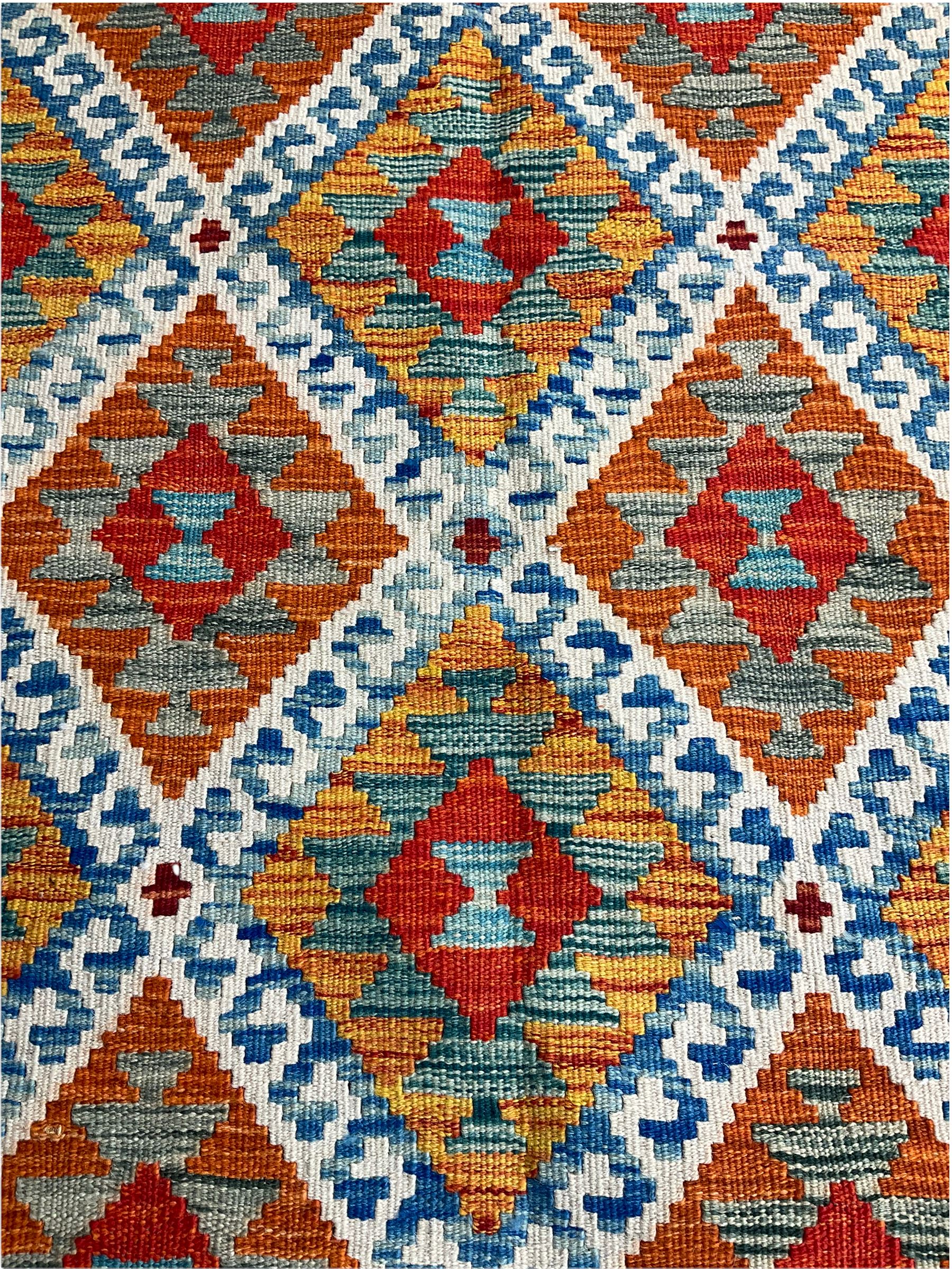 Chobi Kilim rug, orange ground with lozenge and geometric pattern