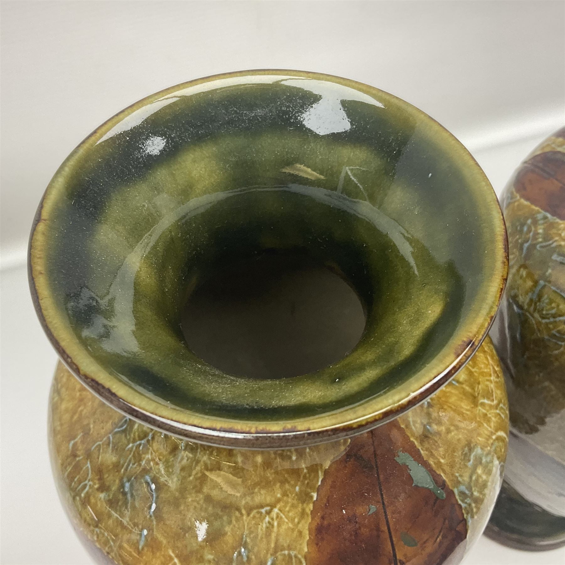 Pair of Royal Doulton Stoneware Vases with leaf decoration, by Ethel Beard, impressed marks to base numbered 6768 and 8222 and initials EB, H32cm