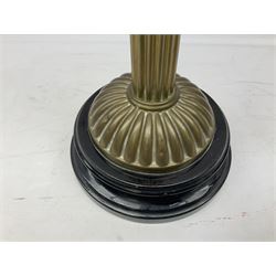 Victorian table oil lamp with black glazed stepped circular base, reeded brass column, moulded pink glass reservoir, duplex burner and frilled rim frosted glass shade with clear glass chimney H69cm