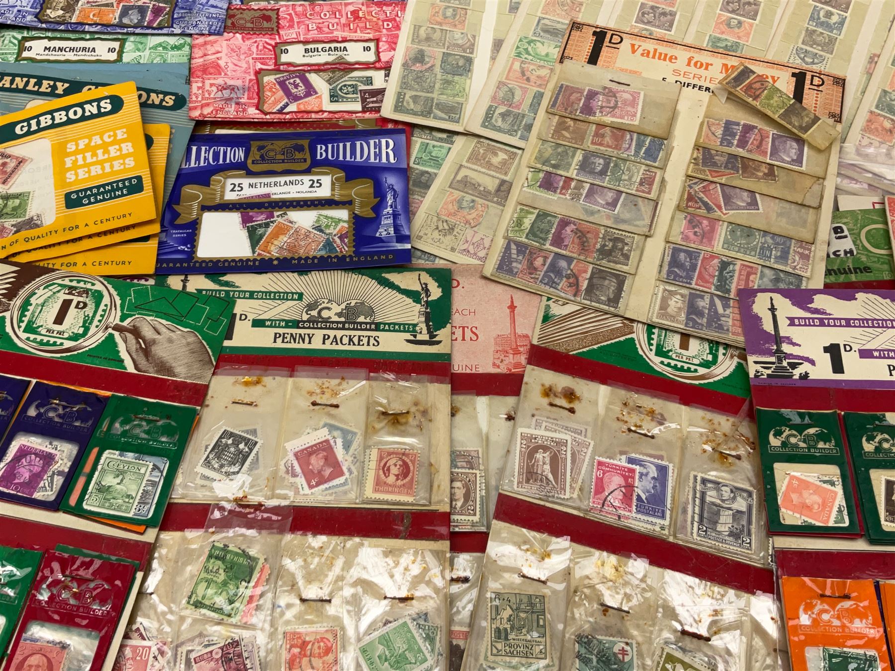 Collection of stamps including packets still mounted to the original shop cards, reading 'A Darracott Product Stamps 1d per pkt' etc, Countries include China, Spain, Argentina, Liberia, Denmark etc, in one box