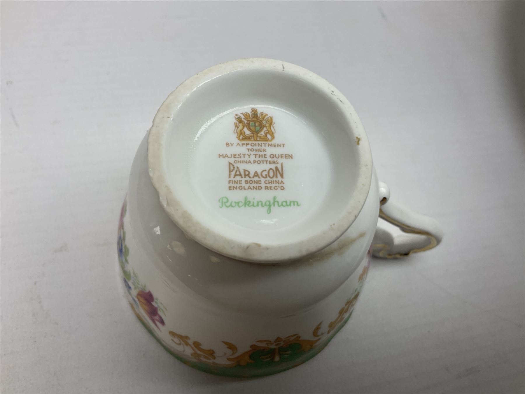 Paragon Rockingham pattern part tea and dinner service including three teapots, milk jug, cups and saucers of various sizes, ten soup bowls, ten side plates, ten dinner plates etc (96)