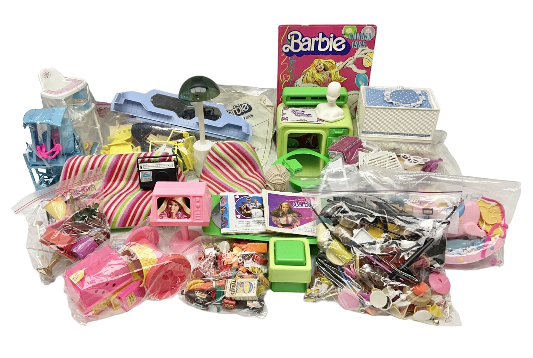 Barbie - collection of 1980s accessories including furniture and outside effects, Fluff the kitten, baby's high chair, playset and nursery items, groceries, crockery, pots and pans, homewares, television, 1985 Annual, transistor radio etc; all unboxed