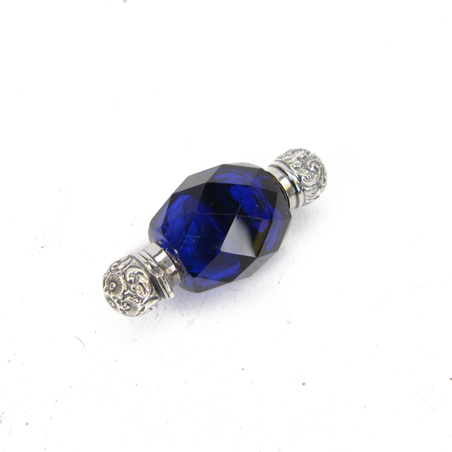 Late 19th century blue faceted glass double ended scent bottle, with embossed silver caps, L7cm