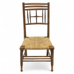 Ford Madox Brown, late 19th century Arts and Crafts child’s chair, with stained ash frame, triple curved top rails and turned spindle supports, the seat with woven rush, on turned legs united by front stretcher