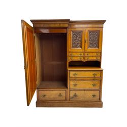 Victorian figured oak and pollard oak combination wardrobe, projecting dentil cornice, the left hand side enclosed by large bevelled mirror glazed door over drawer, the interior with sliding hanging rail, the right hand side with cupboard enclosed by two panelled doors relief carved with urn and trailed trailing foliage, four small drawers over shelf, three drawers and brushing slide, the slide with tooled and gilt blue leather inset, plinth base