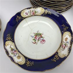 Late Victorian part dinner service, comprising venison platter, meat drainer and platter, six graduating serving platters, two twin handled open tureens, twin handled sauce tureen with cover and saucer, covered serving dish twelve dinner plates, twelve side plates, twelve soup bowls and eleven dessert plates, hand painted with floral sprigs within a cobalt blue border with floral panels, and heightened in gilt