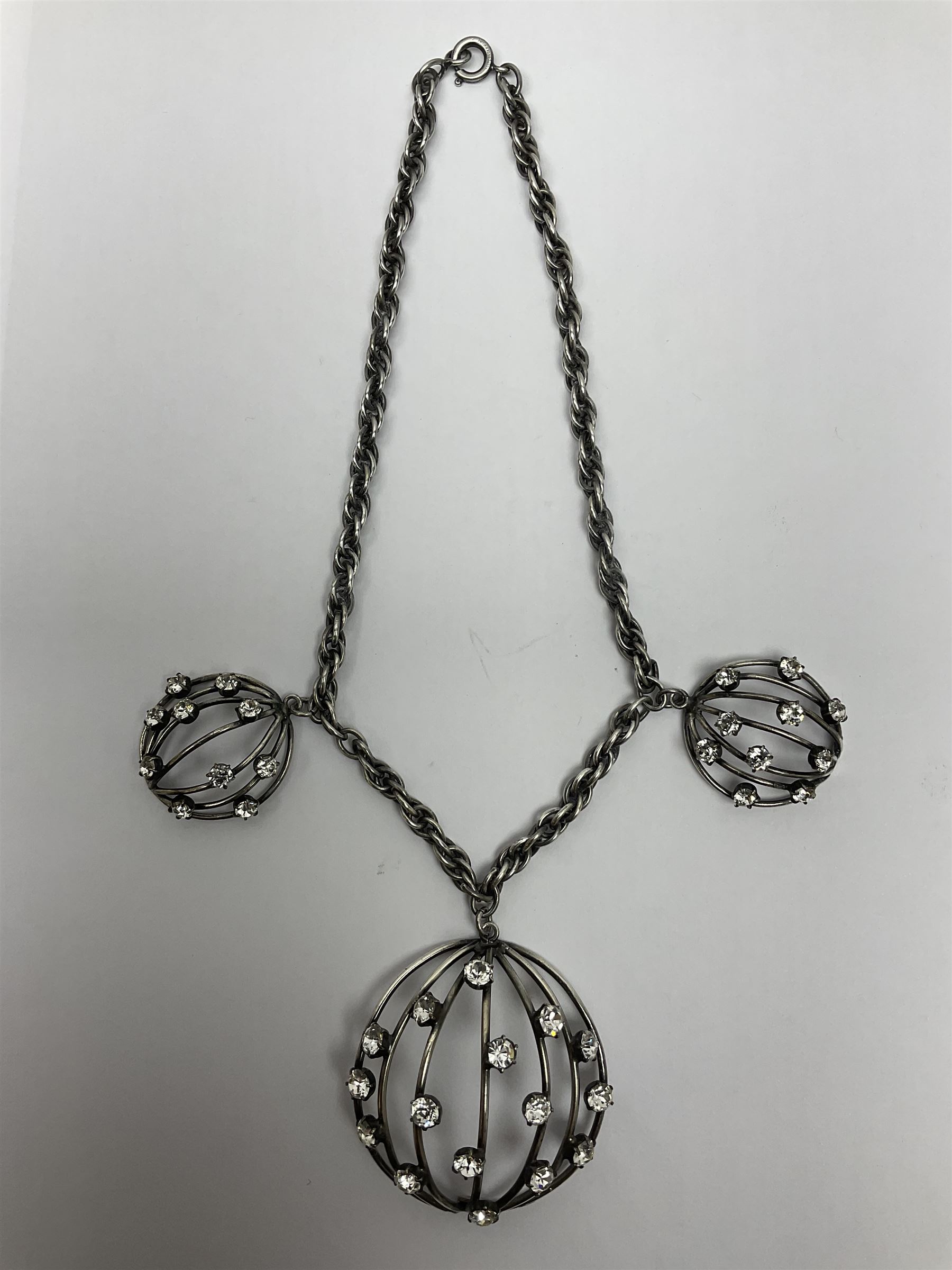 Joseff of Hollywood, circa 1950s metal and white paste necklace, with three graduated pendant drops set with white paste, to a Prince of Wales chain, signed with round script tag