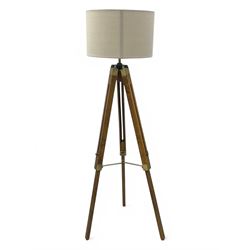 Wooden framed tripod standard lamp, with shade on adjustable legs with brass fititngs