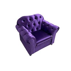 Chesterfield shaped armchair, upholstered in buttoned purple fabric, with scatter cushions