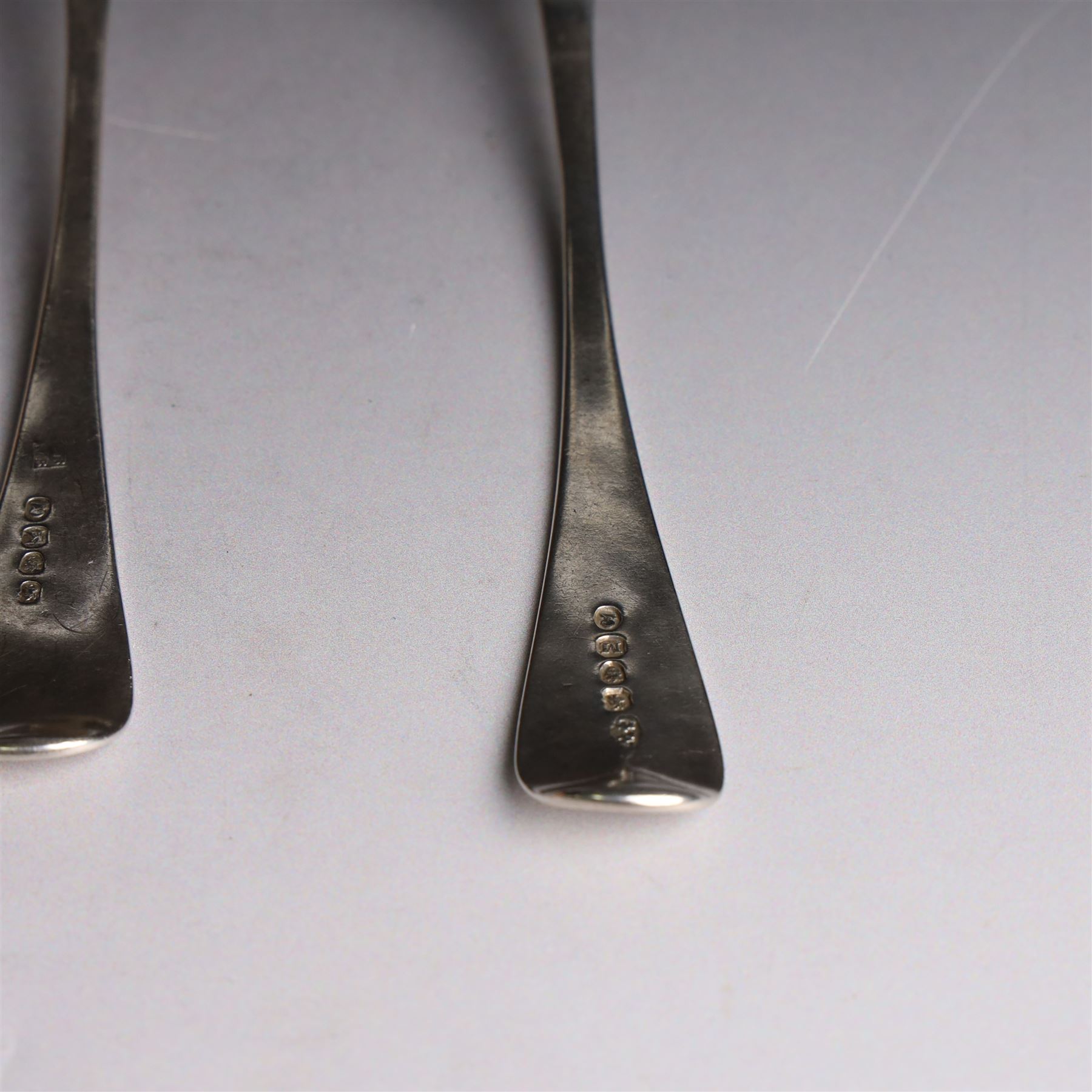 Three George III silver Old English pattern table spoons, one with engraved monogram to terminal, hallmarked Solomon Hougham, London 1802, a further example hallmarked London 1805, makers mark indistinct and one other hallmarked George Wintle, London 1807