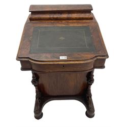 Victorian figured walnut davenport, raised compartment over sloped lid, fitted maple interior, four working drawers to the right hand side, turned front pilasters carved with scroll leaves, on turned feet with castors