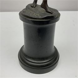 Bronze figure modelled as a nude woman with one arm raised a crescent moon upon her forehead, raised upon a circular stepped plinth, H36cm