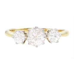 Early 20th century gold diamond three stone ring, the principal old cut diamond of approx ...