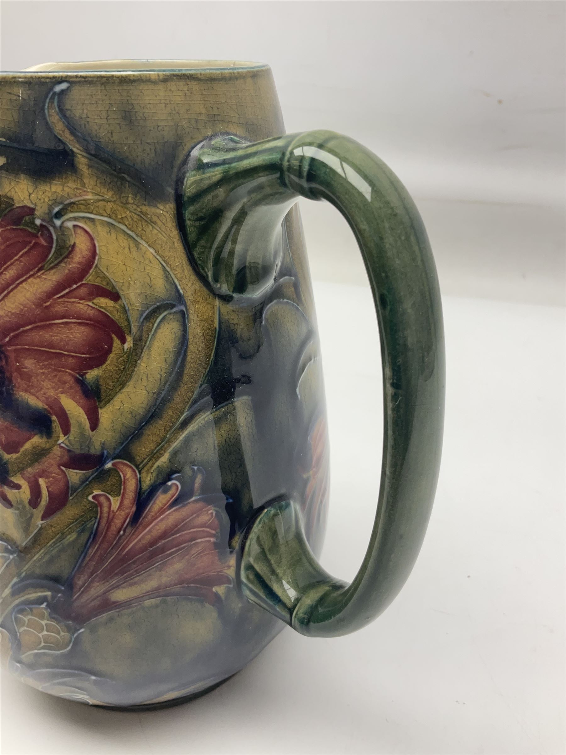 Early 20th century Moorcroft for Macintyre jug, decorated in Revived Cornflower pattern, impressed mark to base, H19cm