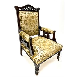 Edwardian mahogany framed gents salon armchair, shaped carved and pierced cresting rail, upholstered back seat and arms, turned supports 