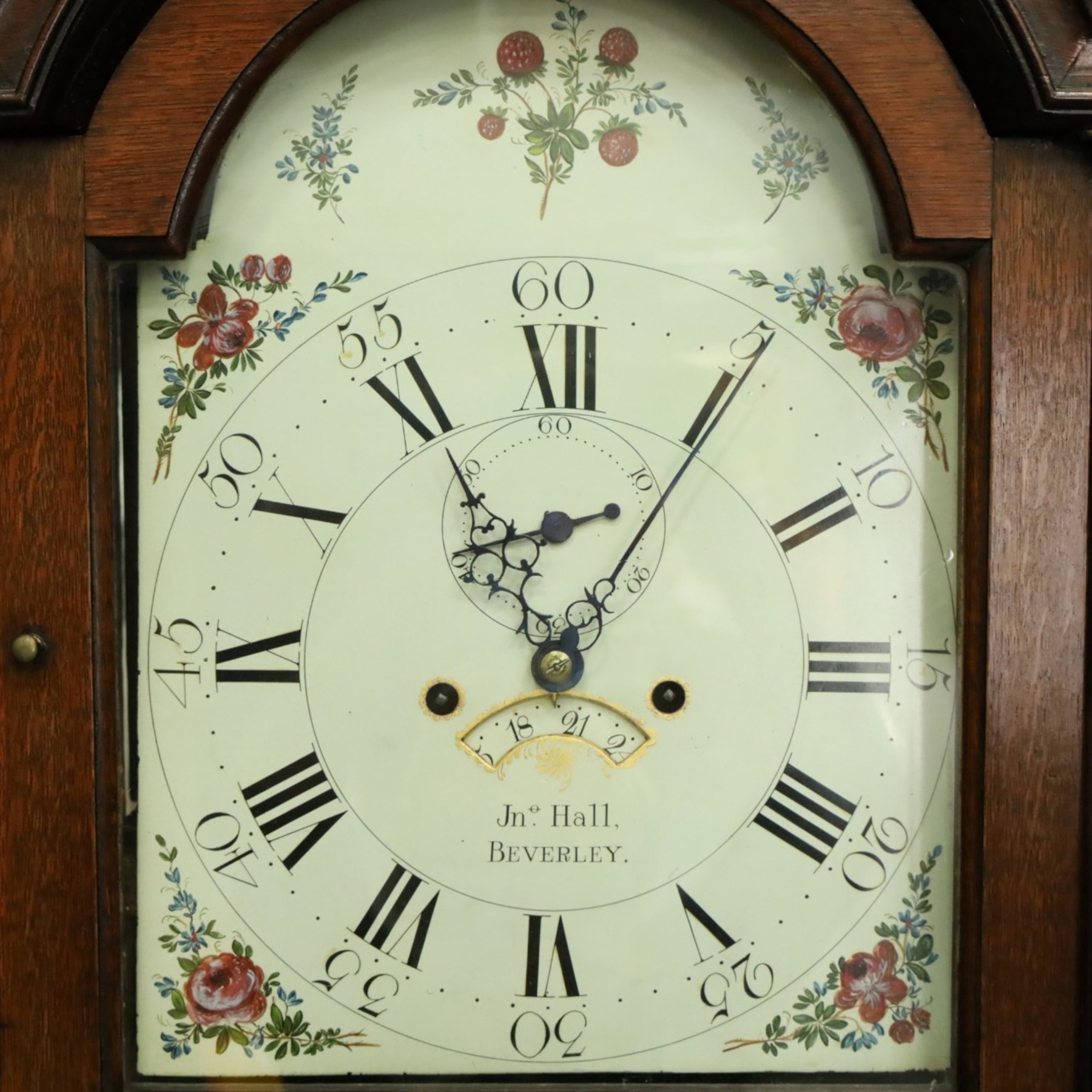 John Hall of Beverley - George III oak eight-day longcase clock, the painted arched dial with subsidiary seconds and date aperture, floral decoration, the case with pagoda top, pierced fretwork panel, brass ball finials, fluted pilasters and arched trunk door