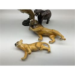 Collection of Beswick figures, comprising trout model no 1032, elephant model no 974, lion model no 2089, and lion cub model no 2098.