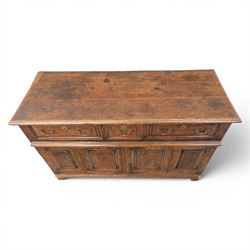 George III oak dresser base, rectangular top with moulded edge, three fielded panelled drawers with brass swan neck handles, over four fielded panelled front with the central two cupboard doors, raised on stile supports